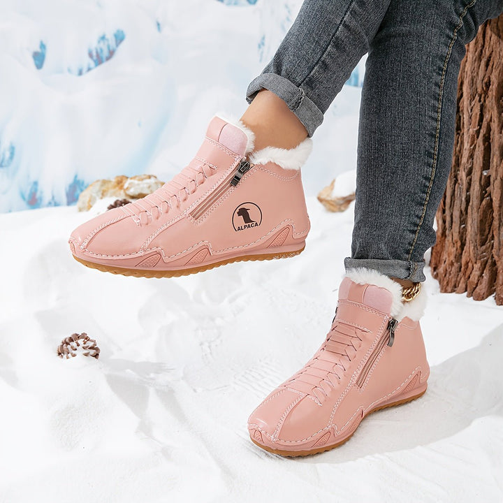 Pink fur lined ankle boots with side zip and laces