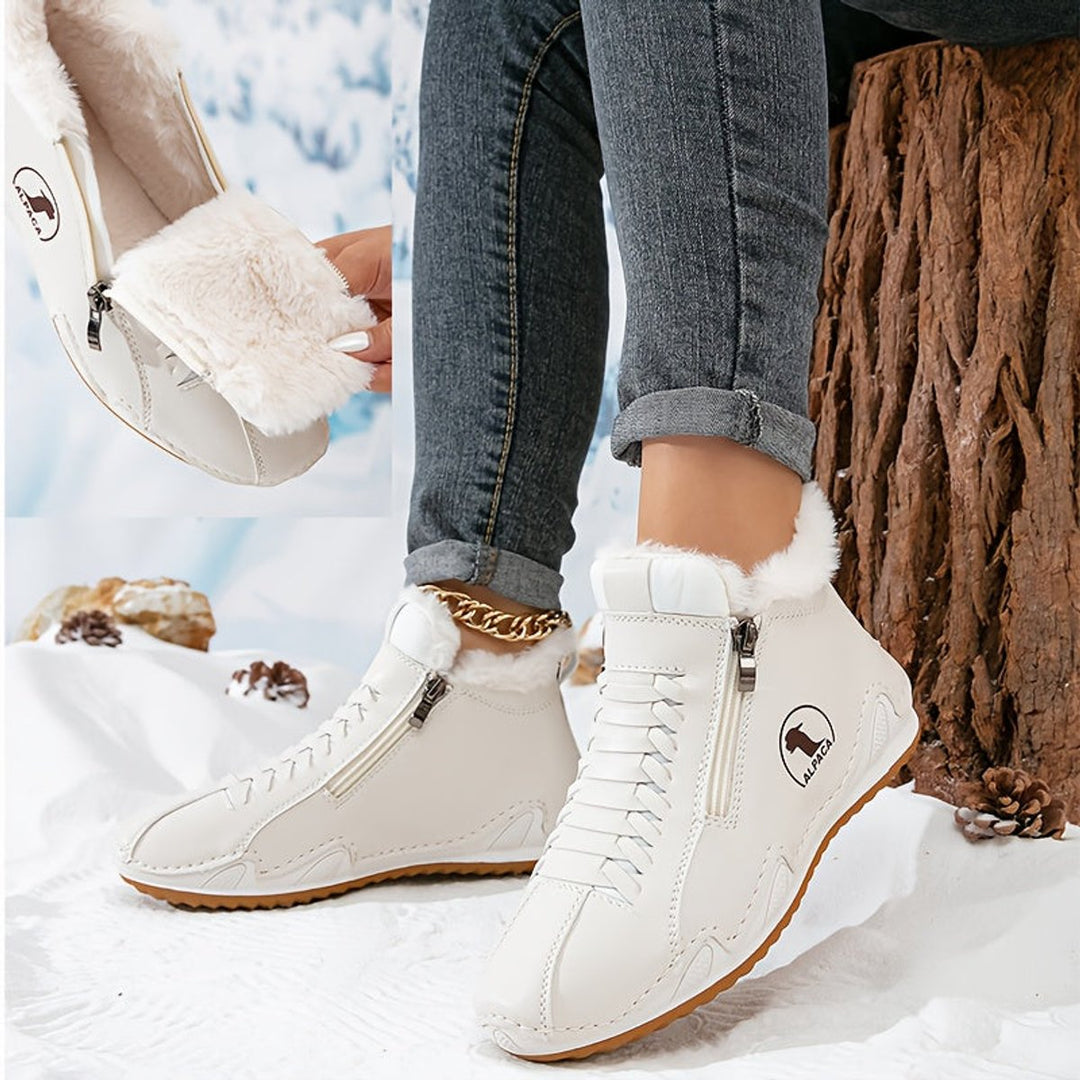 Women's ankle boots in white, fur lined lace up with side zip in the snow
