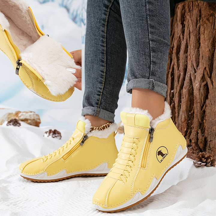 Yellow fur lined ankle boots worn with jeans