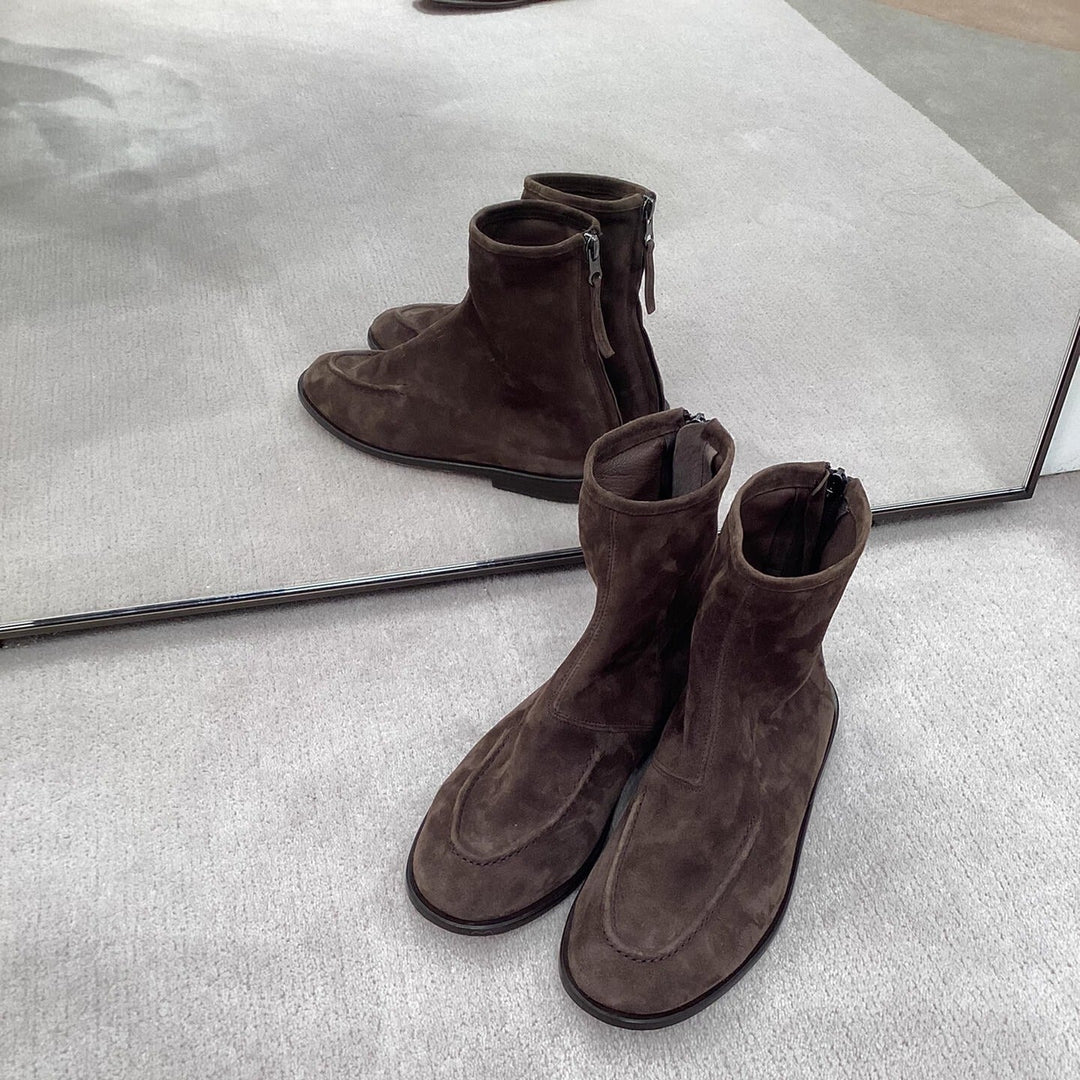 Brown suede look ankle boots worn with black trousers