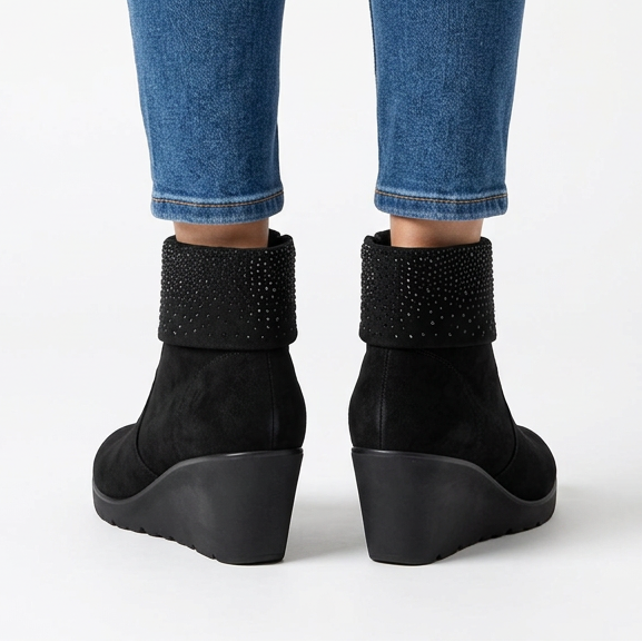 Back view of black suede-look wedge booties with rhinestone cuff