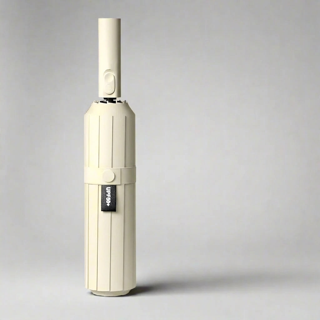 Automatic folding umbrella in cream, closed and standing upright