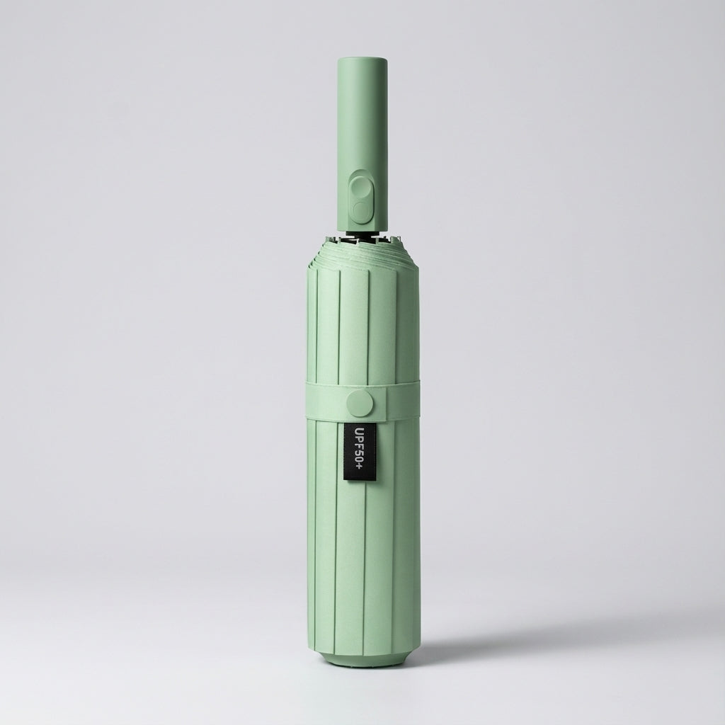 Automatic folding umbrella in mint, closed and standing upright