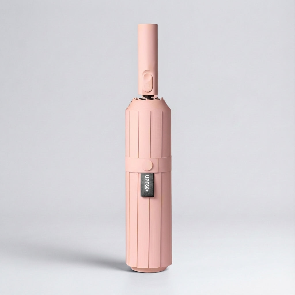 Automatic folding umbrella in pink, closed and standing upright
