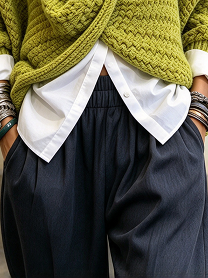 Close-up of the elastic waistband, front pleats and side pocket