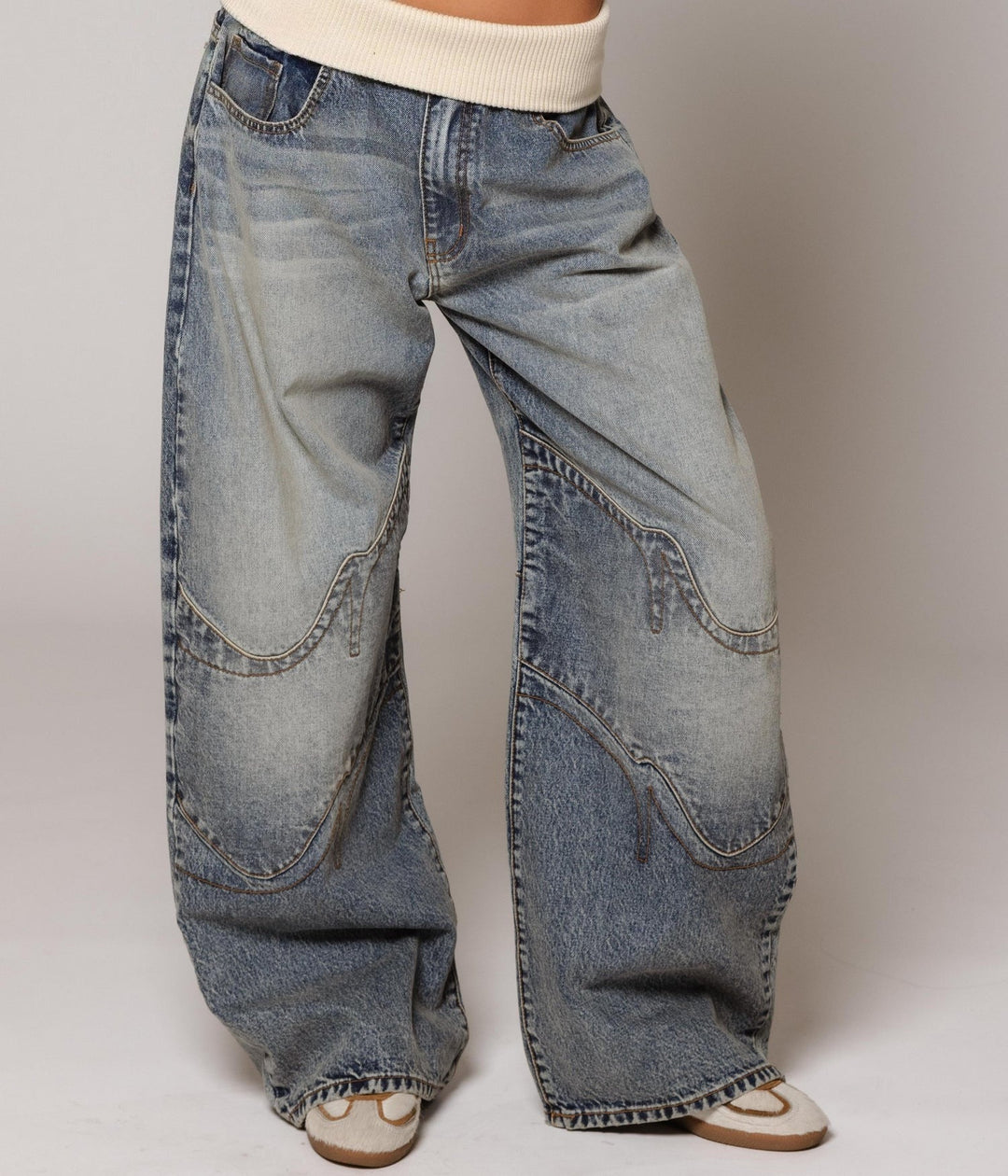 Women's vintage blue low rise barrel jeans, front view on a model