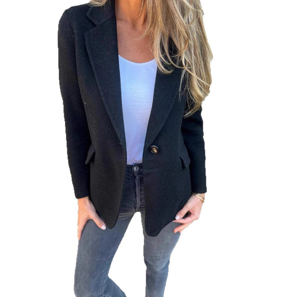 Black blazer jacket with a longer cut that skims the hips