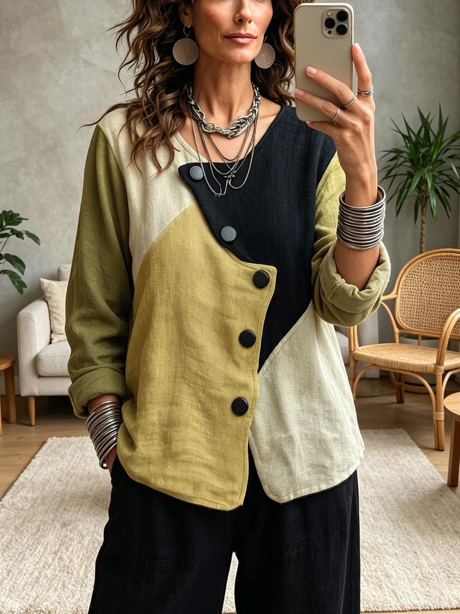 Mirror selfie in the button-front blouse with black wide-leg pants and silver bangles