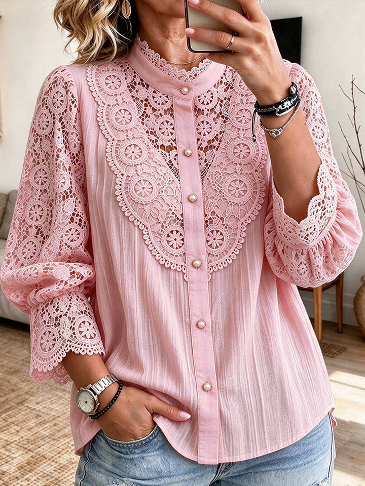 Pink blouse with lace yoke and scalloped cuffs, worn with denim
