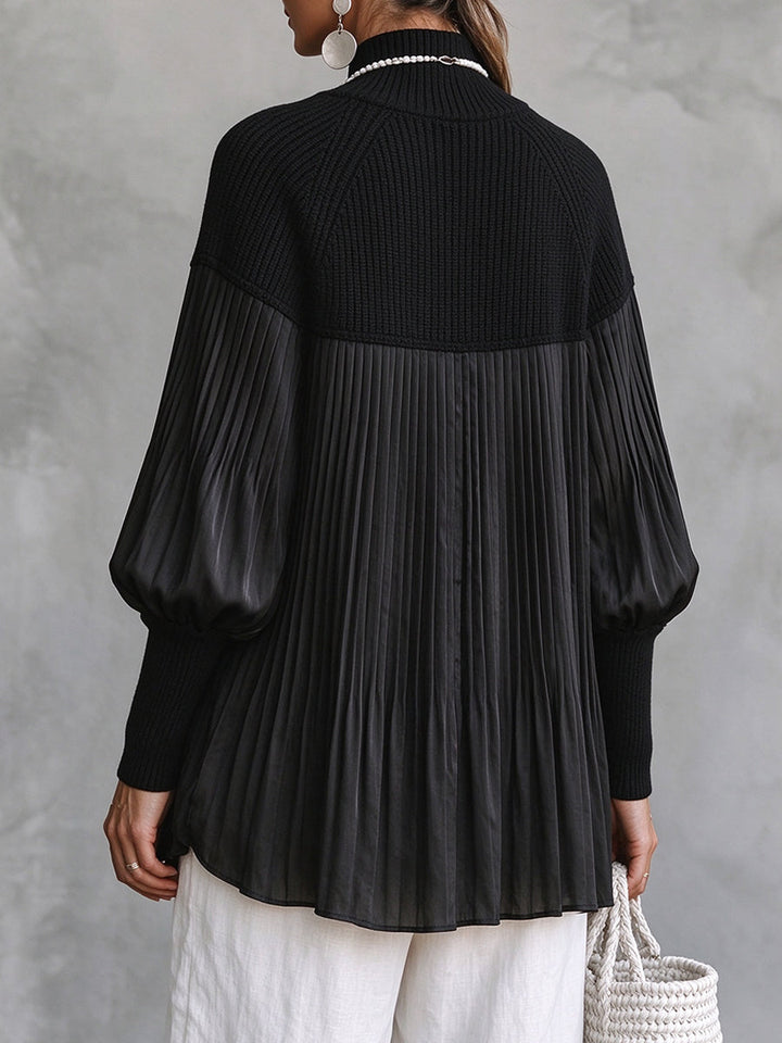 Back view of the pleated blouse with knit yoke and balloon sleeves