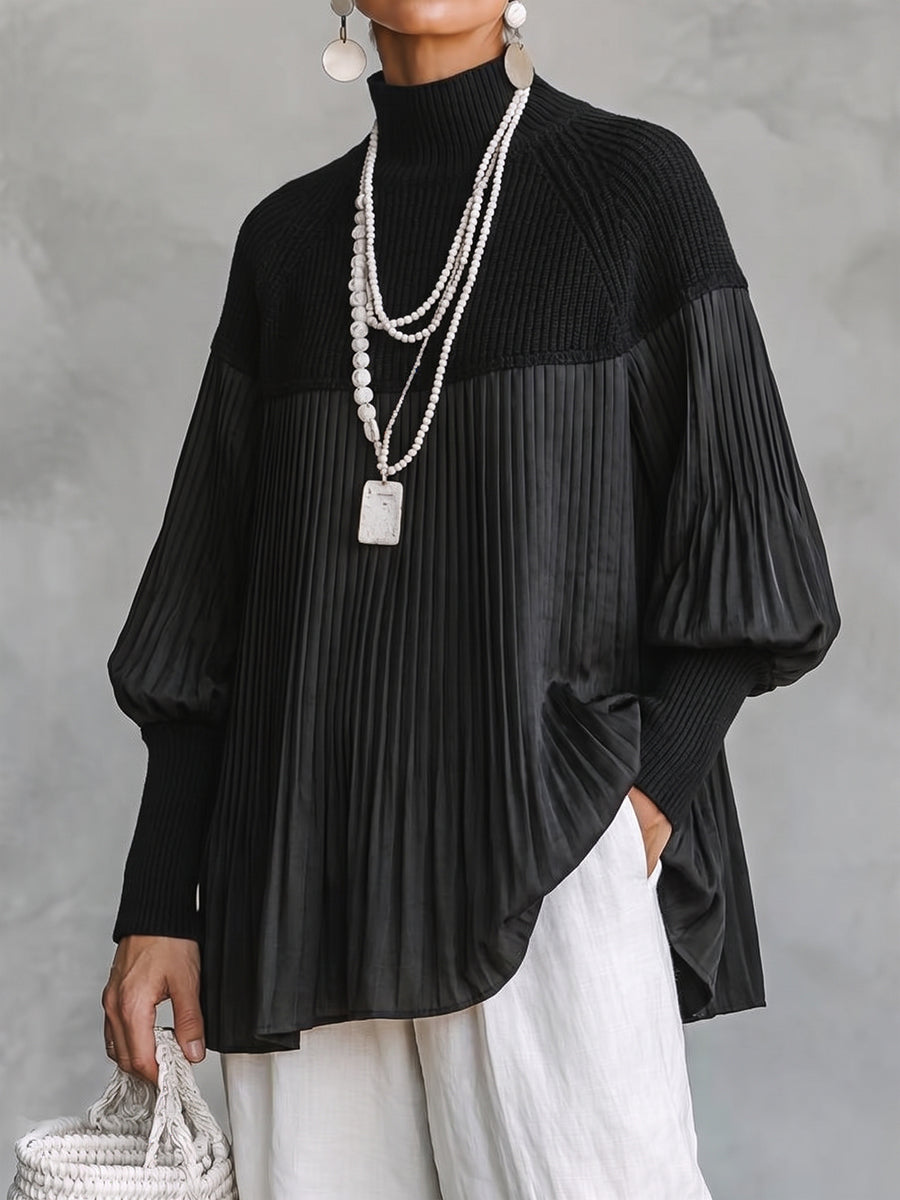Women's blouse in black with pleated tunic body and ribbed knit mock neck