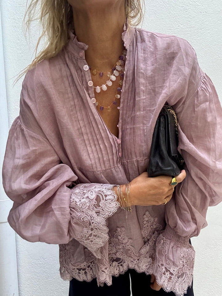 Mauve blouse with half button placket, styled with a beaded necklace and black clutch