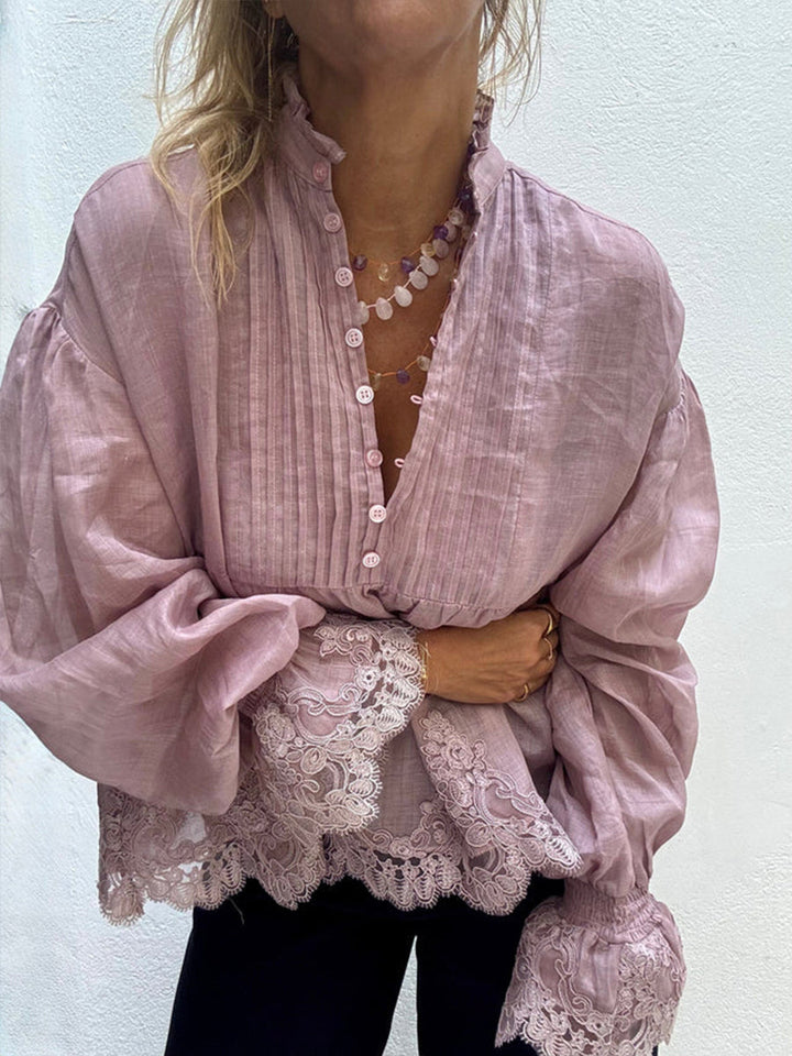 Front view of the frilled collar and wide lace cuffs on the mauve blouse
