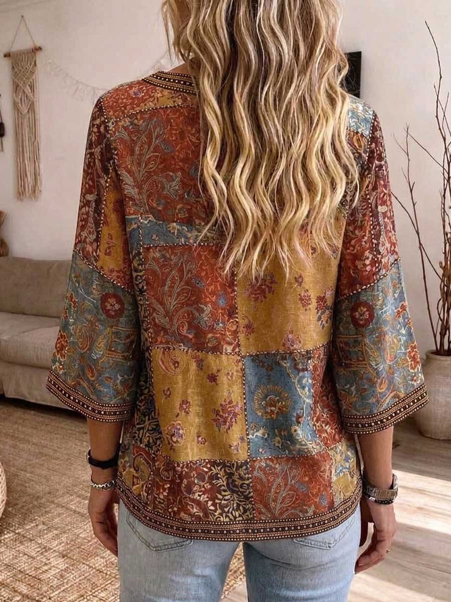 Back view of the patchwork blouse in rust, mustard and blue paisley panels