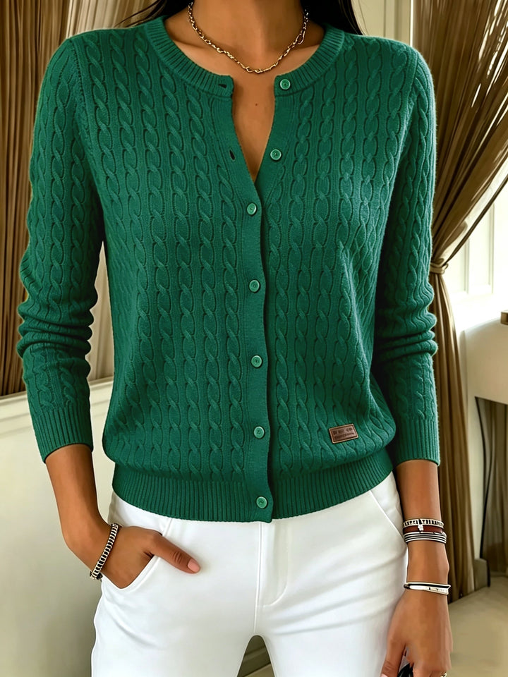 Forest green cable knit cardigan with button front and ribbed hem