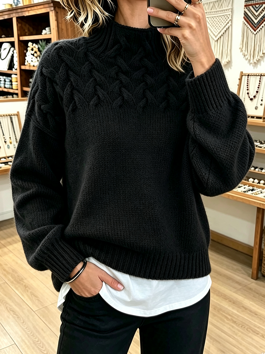 Black mock neck sweater with textured cable yoke