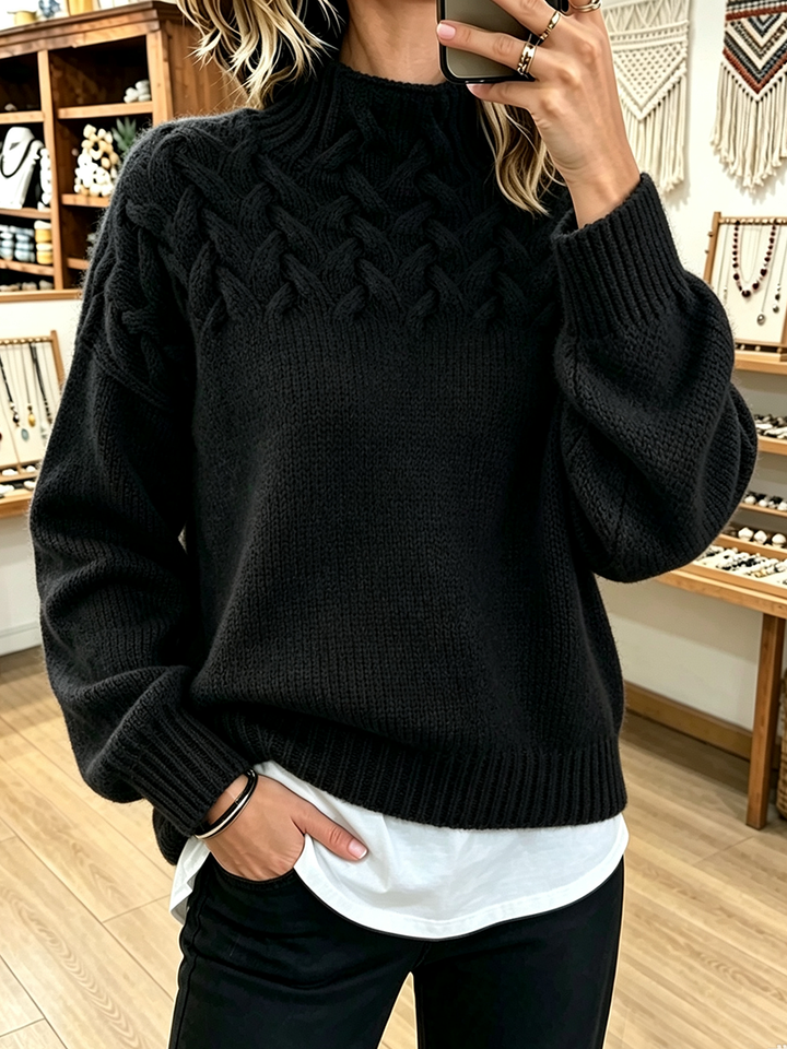 Black mock neck sweater with textured cable yoke
