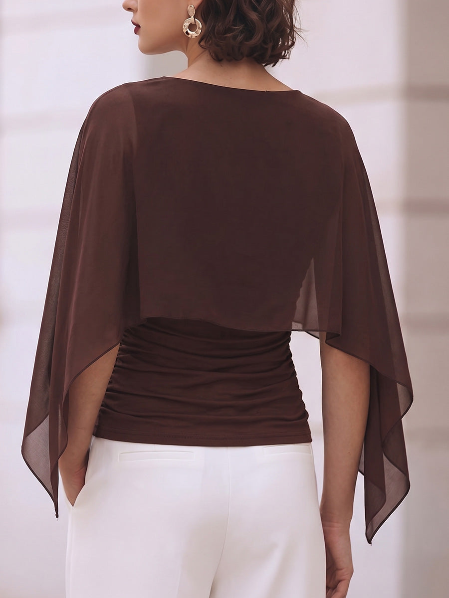 Back view of the brown top showing the sheer cape falling past the waist