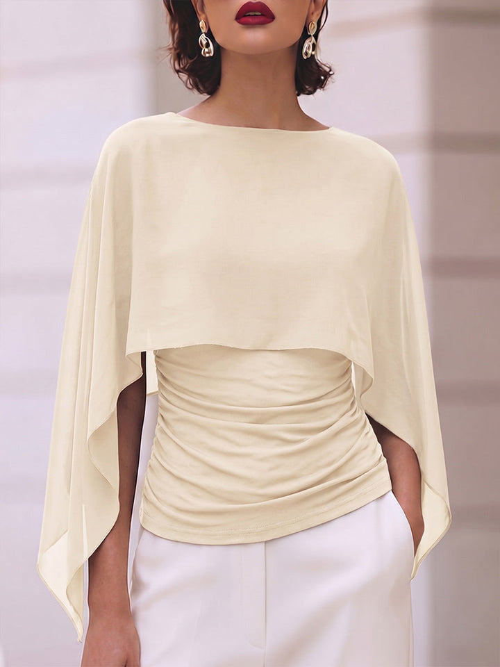 Cream ruched top with a flowing sheer layer over the arms