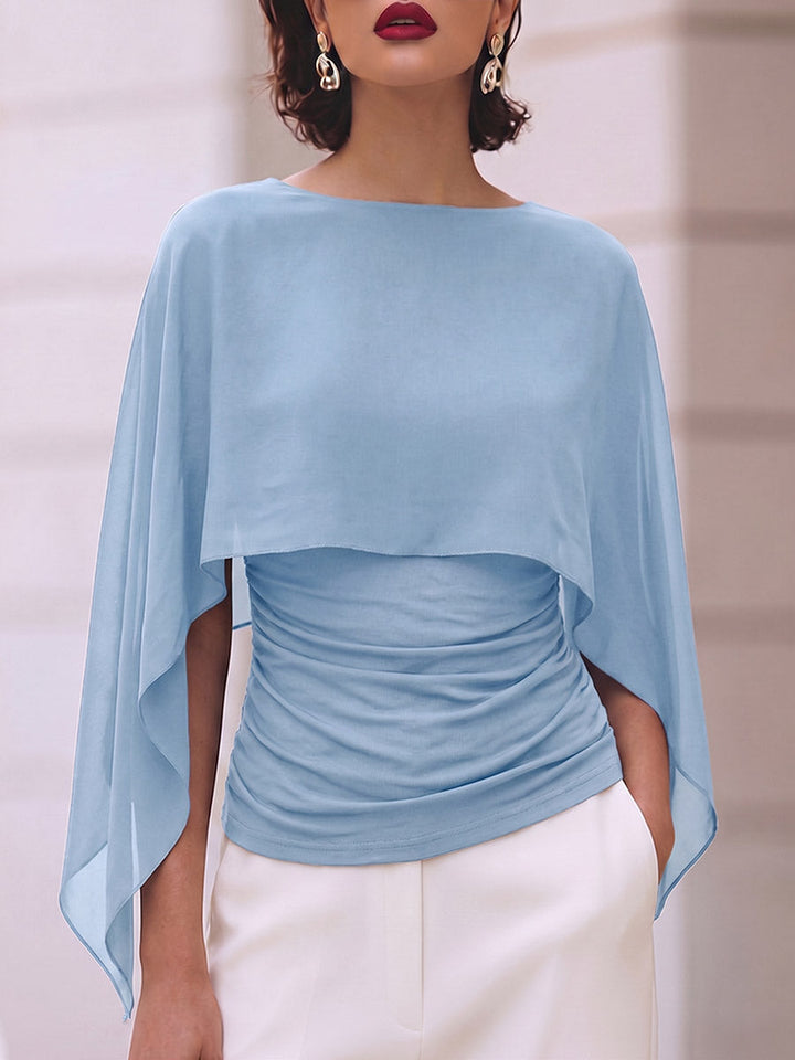 Light blue sheer cape top with a clean round neckline