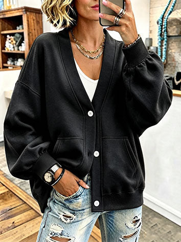 Black sweatshirt-style cardigan with crisp white buttons