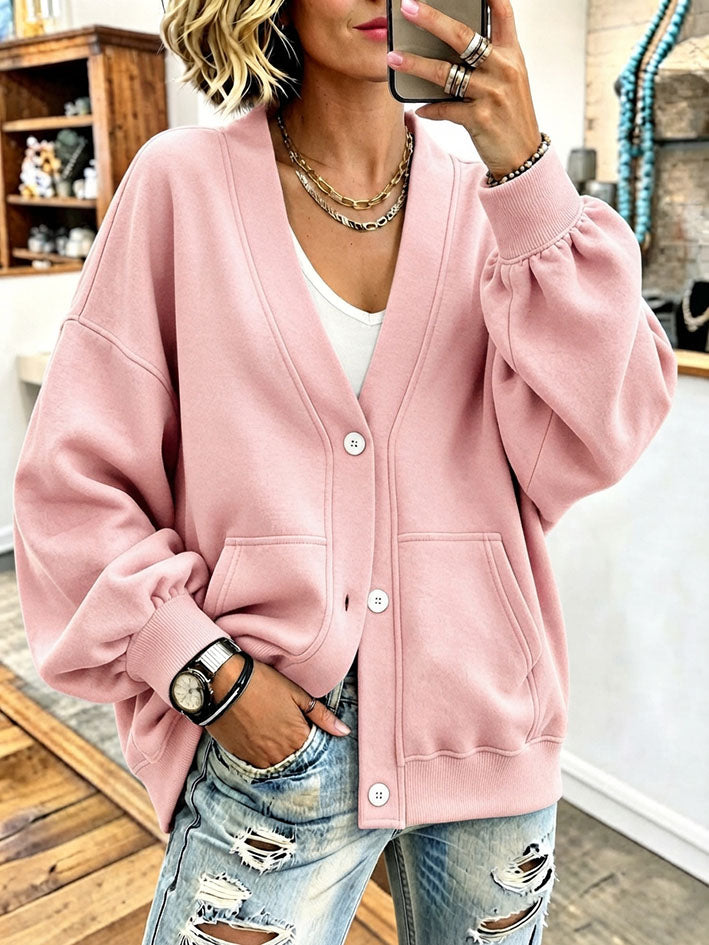 Pink oversized cardigan with two front patch pockets
