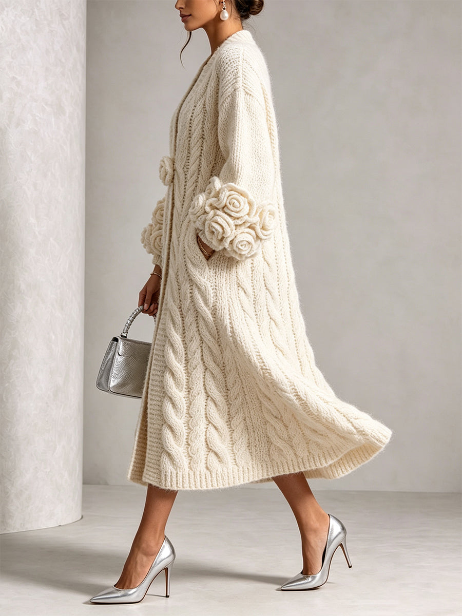 Cream cable knit duster cardigan seen from the side while walking