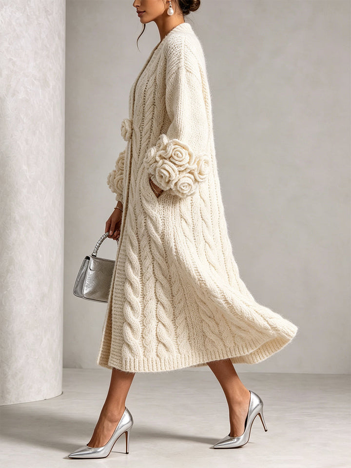Cream cable knit duster cardigan seen from the side while walking