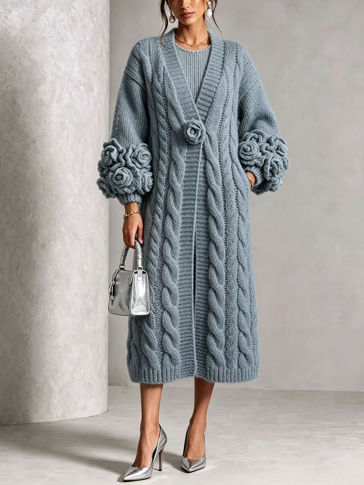 Light blue cable knit duster cardigan worn open