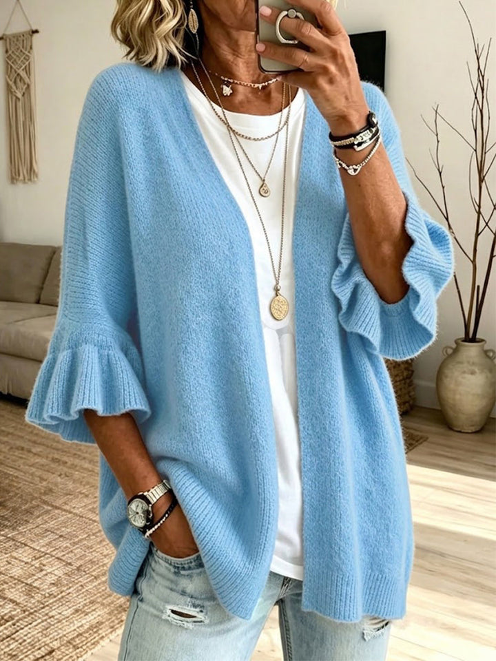 Sky blue cardigan with ruffle-trimmed sleeves and dropped shoulders