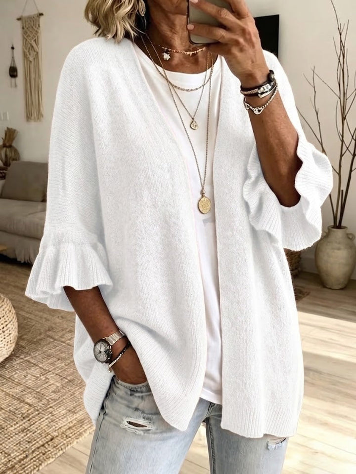 White lightweight knit cardigan with soft bell cuffs