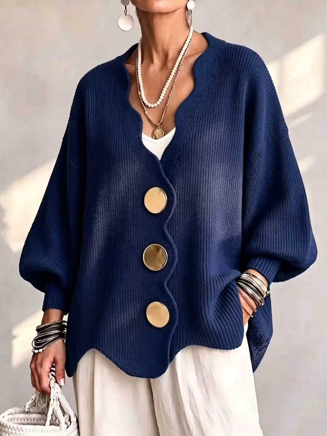 Women's cardigan sweater in navy, oversized v neck button front with scalloped hem