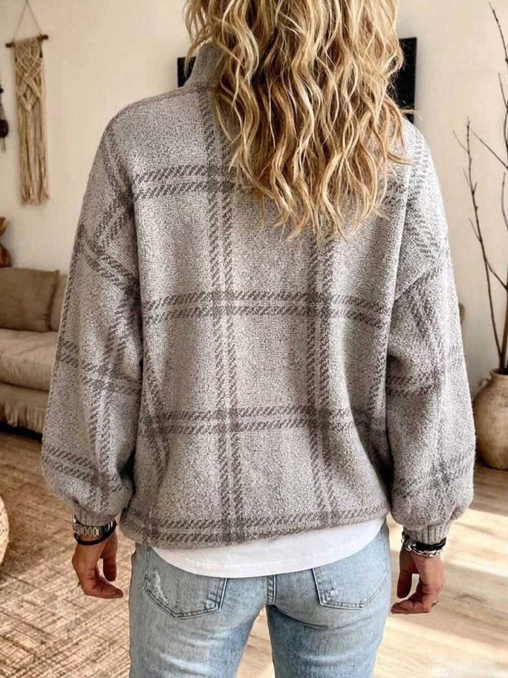 Back view of the gray plaid cardigan with balloon sleeves and ribbed hem