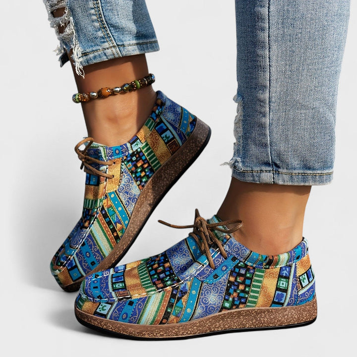 Blue boho print lace up shoes worn with jeans