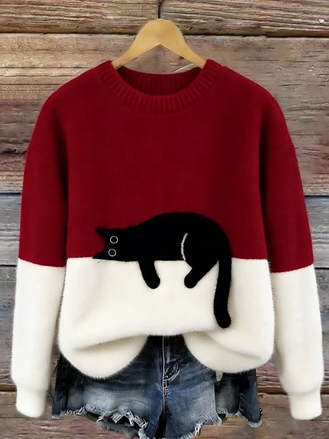 Red oversized cat sweater with white bottom half and a black cat print
