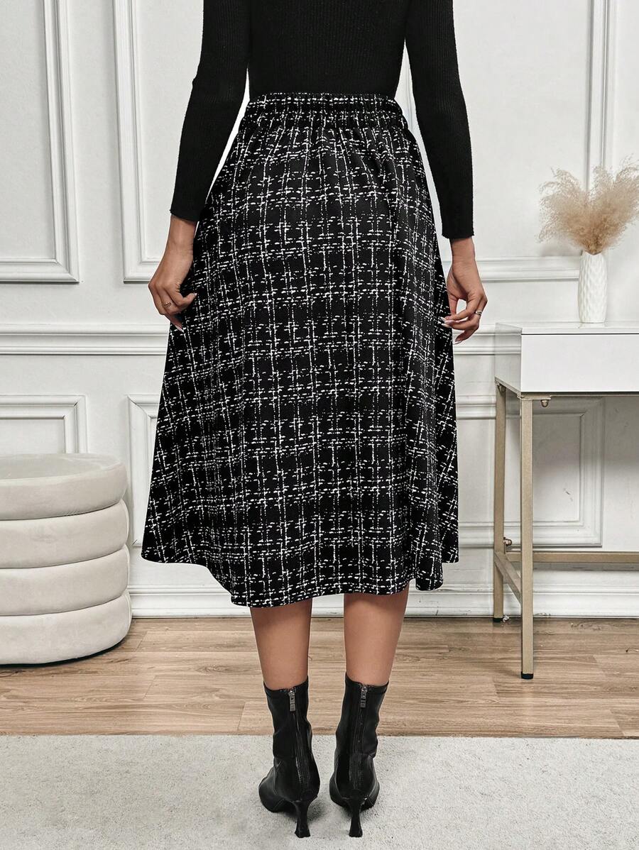 Back view of the checkered midi skirt with black ankle boots