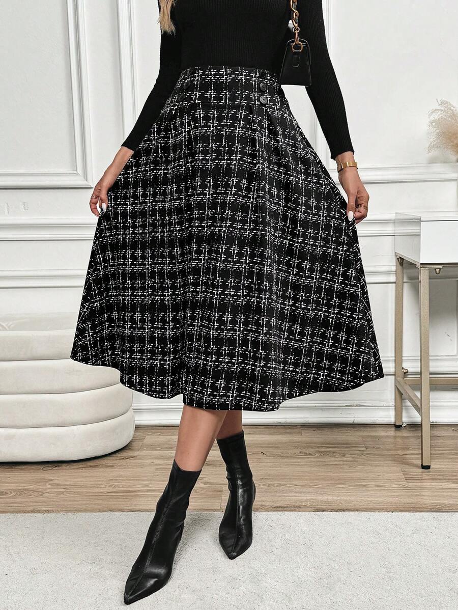A-line tweed-look midi skirt with a flared hem, worn with pointed black boots