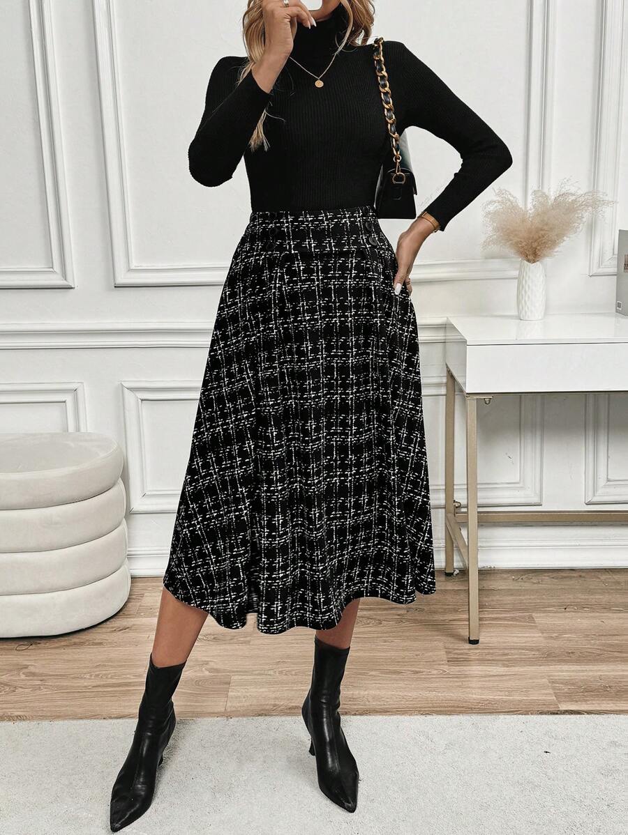 Side angle of the black checkered A-line skirt with a turtleneck top and boots