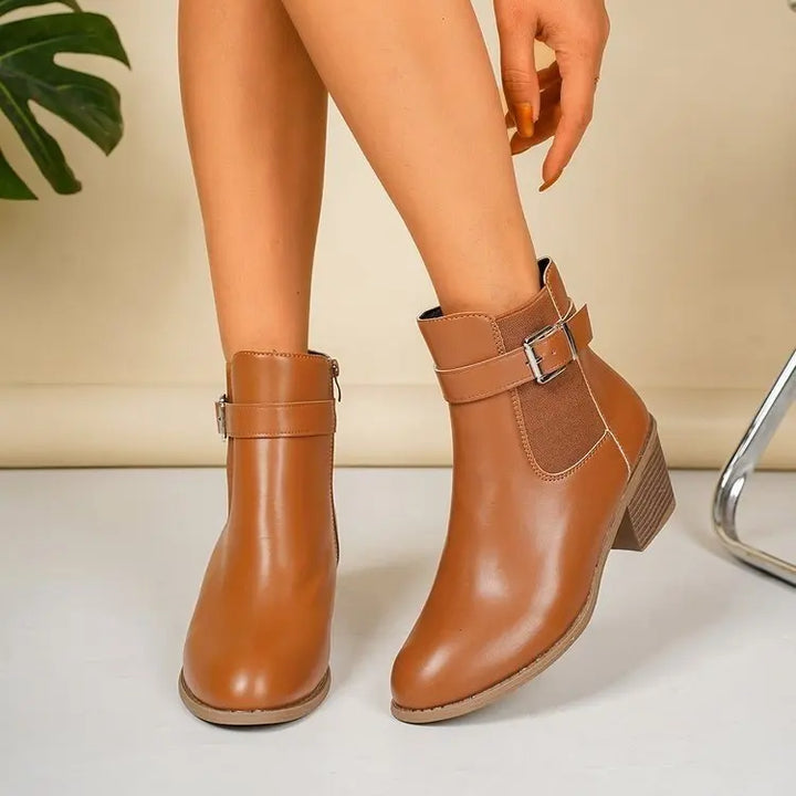 Camel block heel Chelsea ankle boots with elastic side panel, worn with bare legs