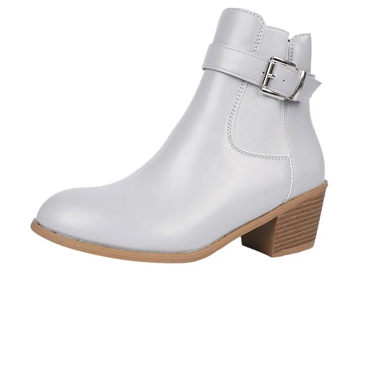 Gray block heel Chelsea ankle boot with buckle strap on a white background