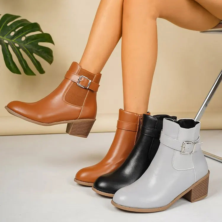 Camel, black and gray block heel Chelsea ankle boots with buckle strap, shown together