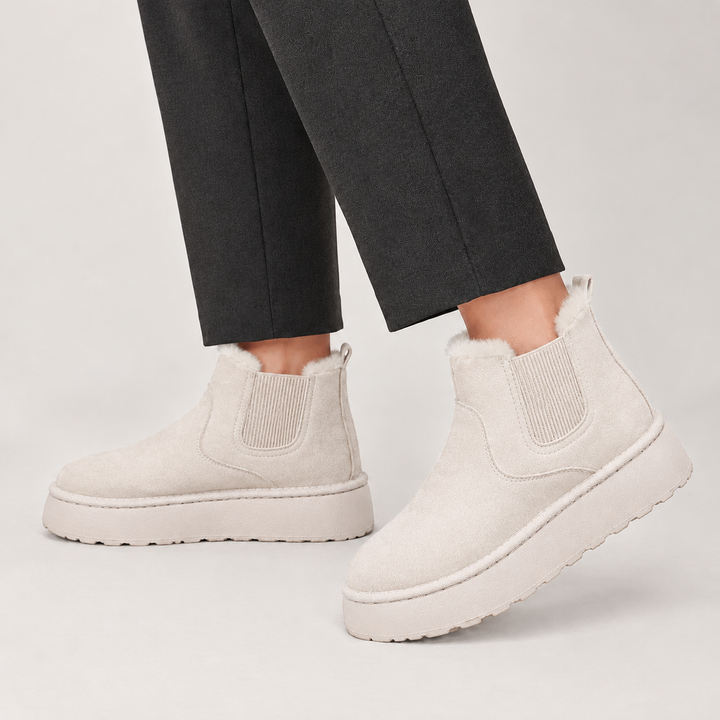 Off white mini chelsea boots on a chunky platform sole