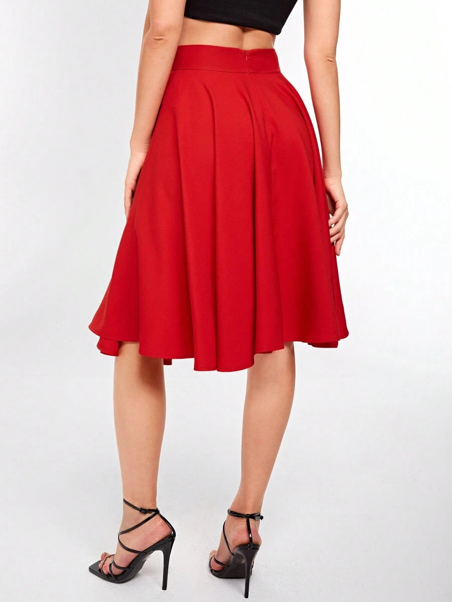 Back view of the red knee length circle skirt with pleated waist