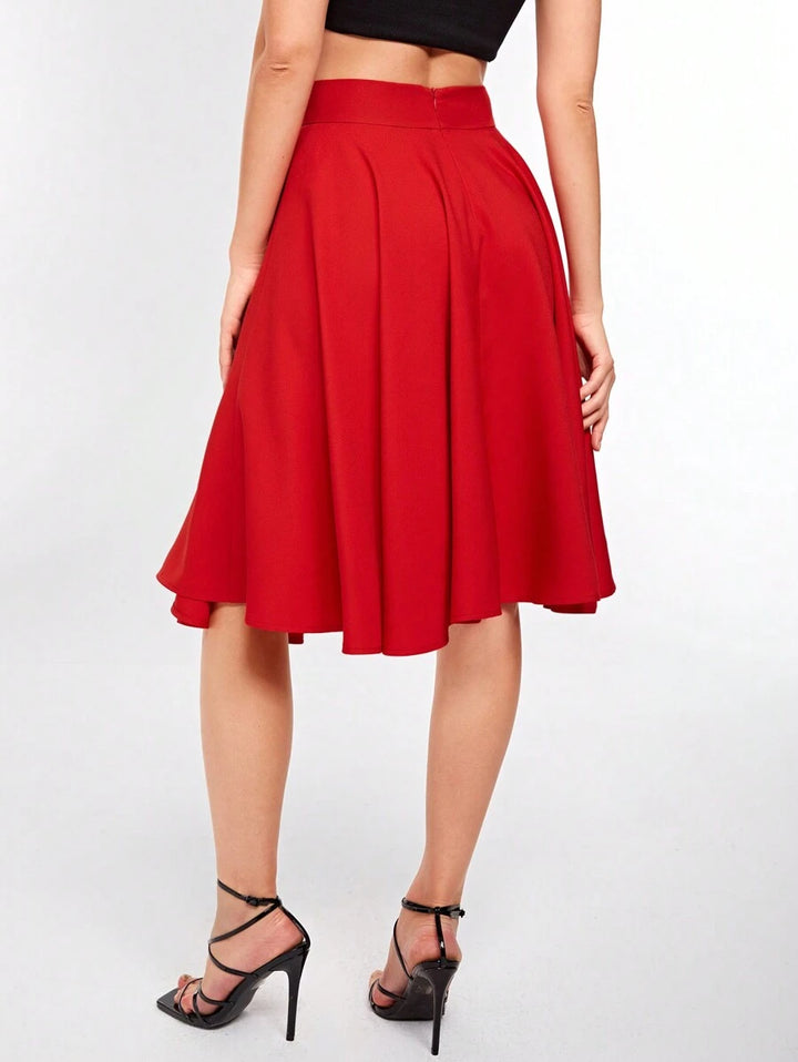 Back view of the red knee length circle skirt with pleated waist
