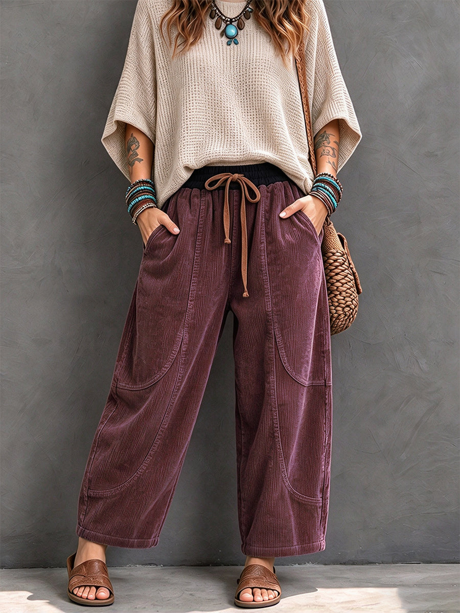 Plum corduroy pants with curved panel seams and roomy pockets