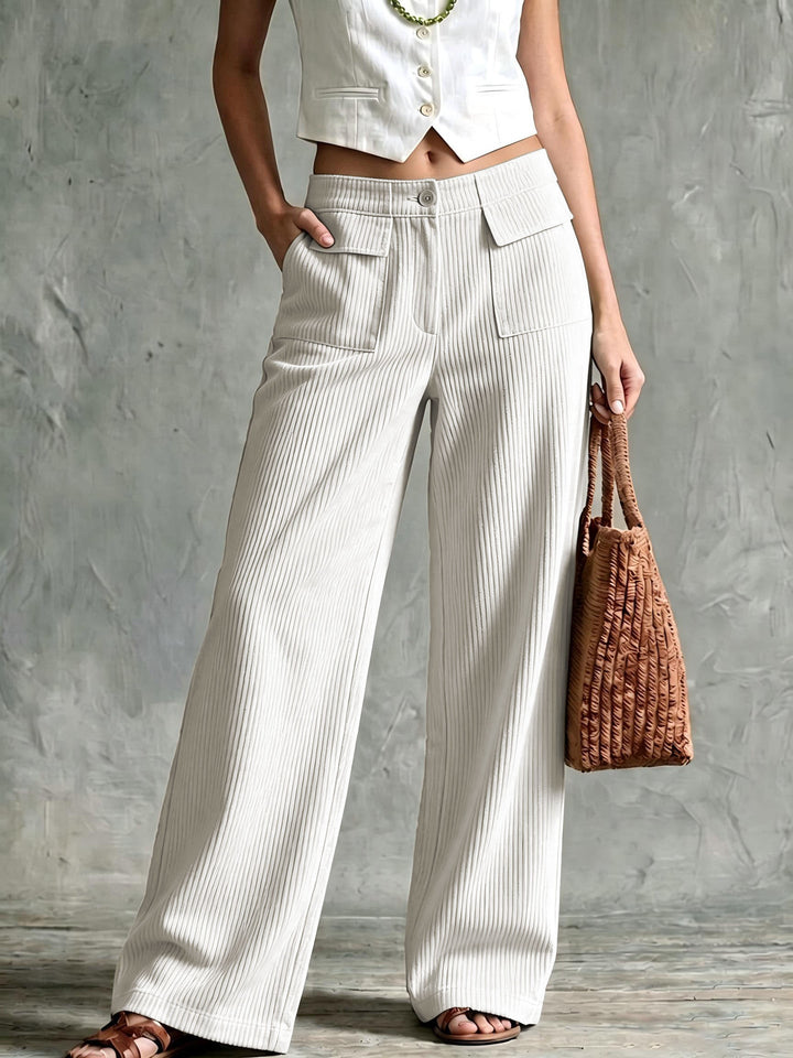 Ivory high-rise corduroy pants with a floor-length wide leg