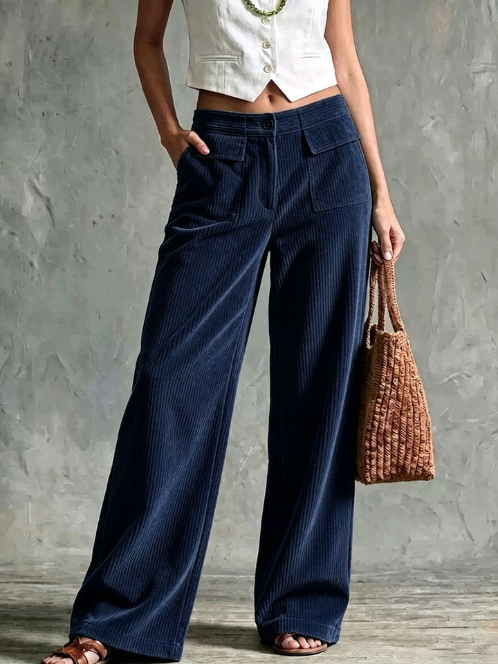 Navy corduroy pants with fine ribs and a straight wide leg