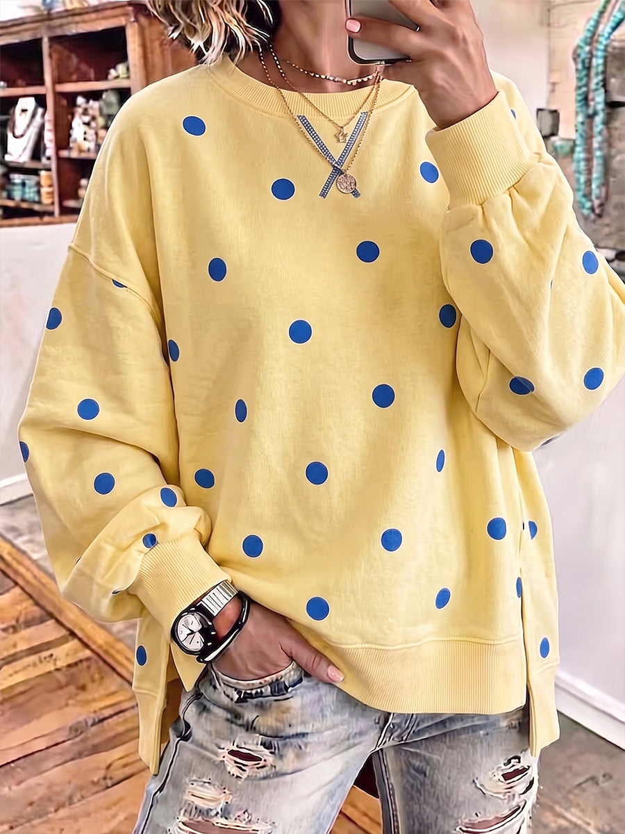 Women's crewneck sweatshirt in yellow with blue polka dot print and side slits