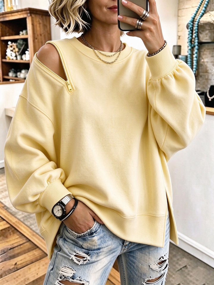 Pale yellow crewneck sweatshirt with lantern sleeves and ribbed cuffs