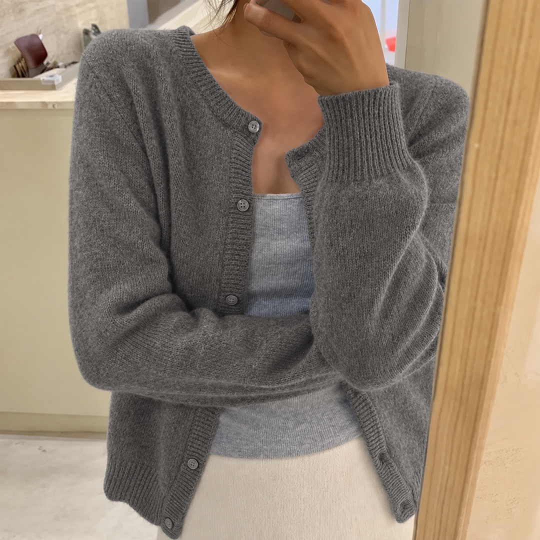 Women's gray cropped crew neck cardigan, front view on a model